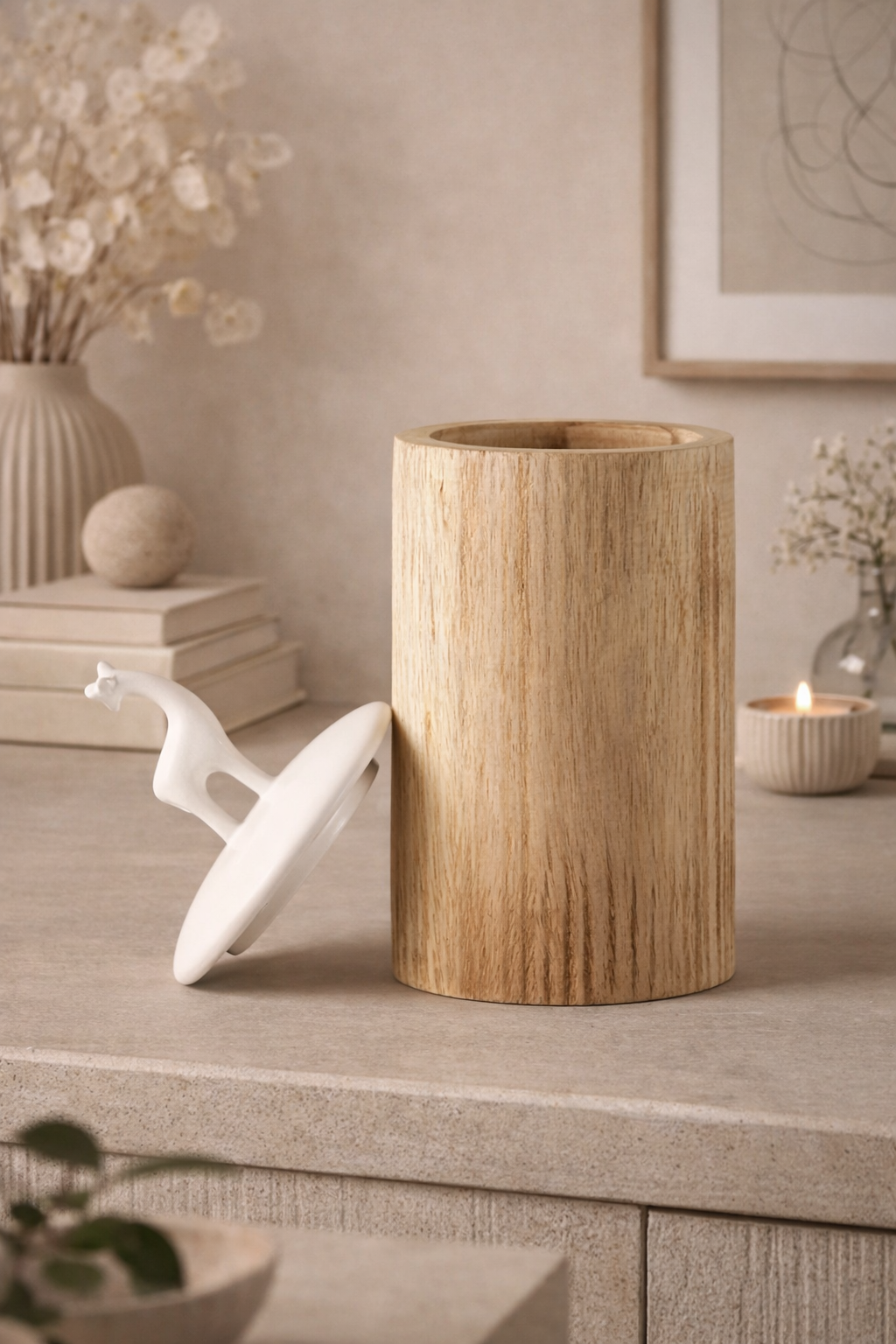 Wooden vase on a table with decorative items in a home setting