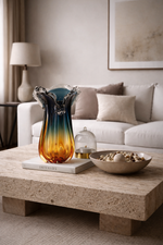 Decorative items on a coffee table in a living room setting