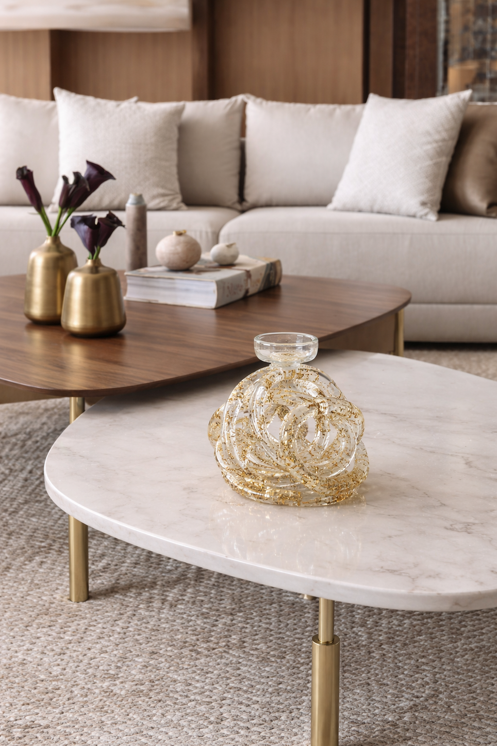 Living room with a beige sofa, wooden coffee table, and decorative items.