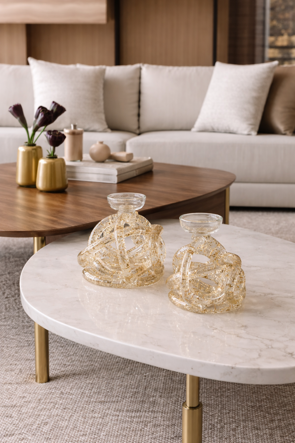 Living room with a beige sofa, wooden coffee table, and decorative items.