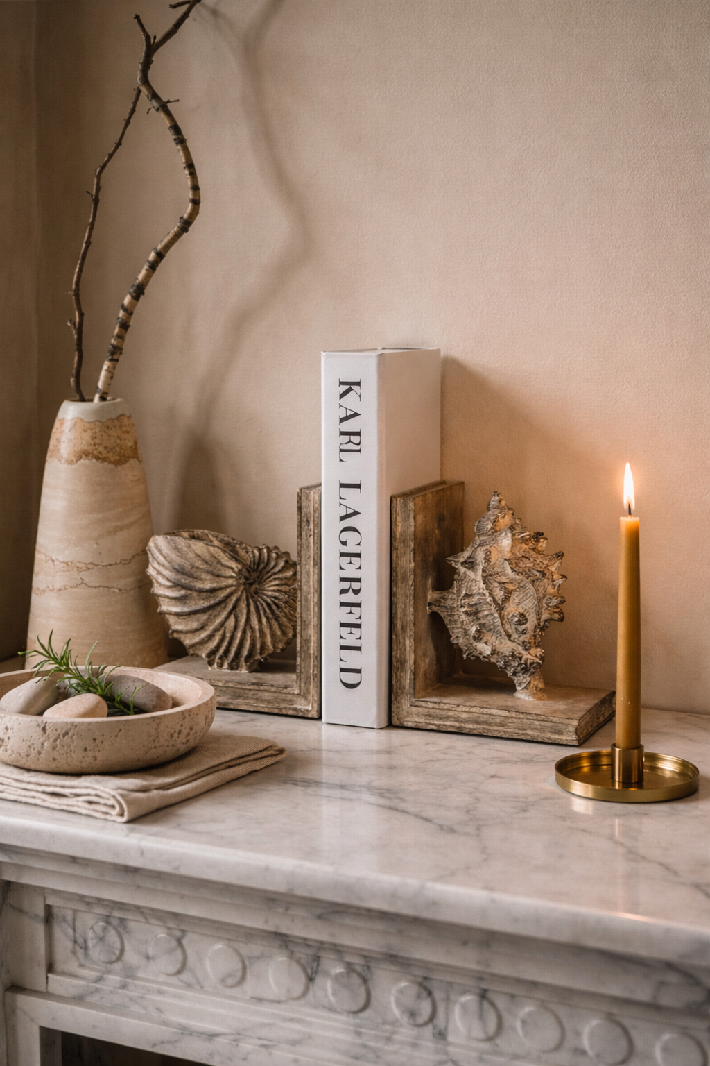 Decorative items on a marble surface with a neutral background