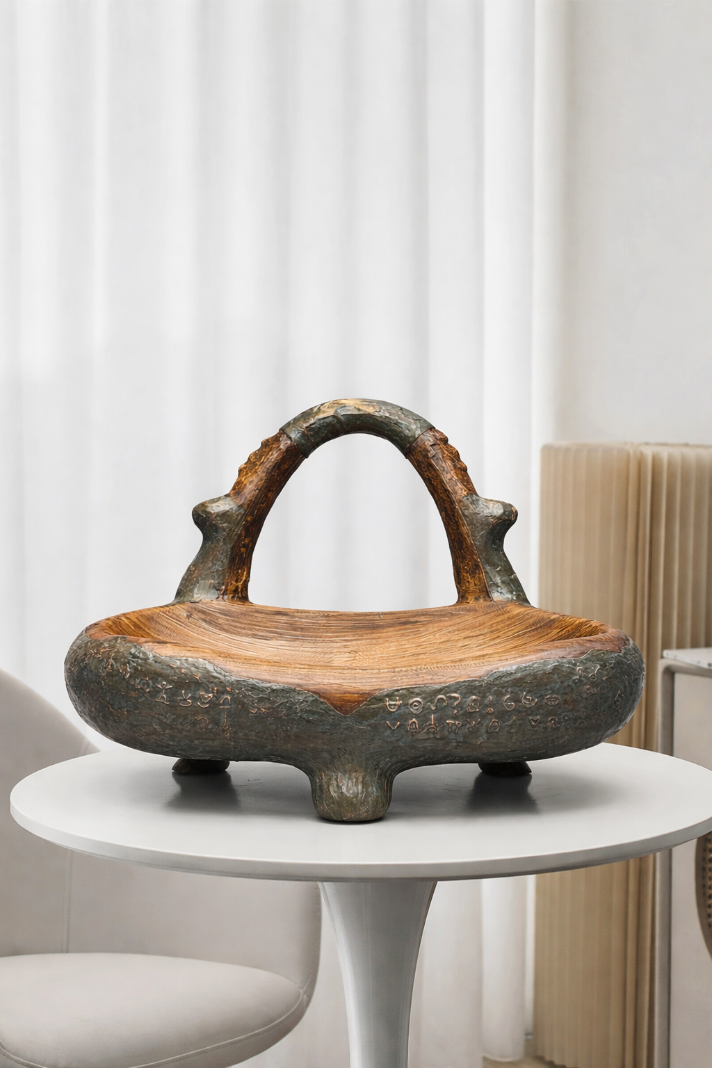 Decorative wooden bowl with rustic design on a white table