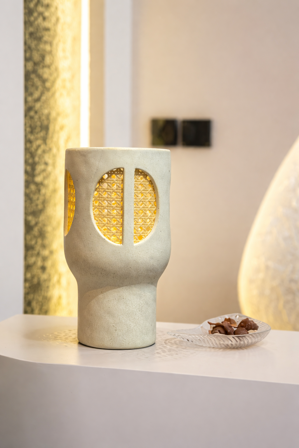 Ceramic lamp with textured design on a white surface