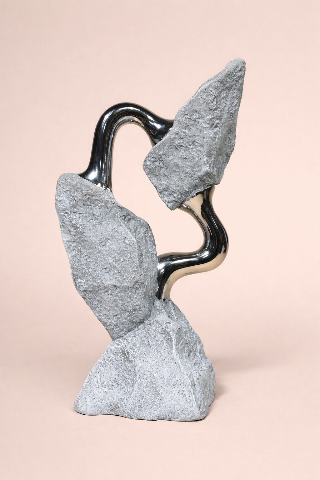 Abstract stone sculpture on a beige background