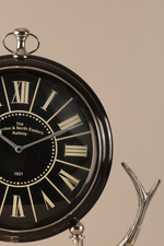 Vintage-style clock with Roman numerals on a beige background