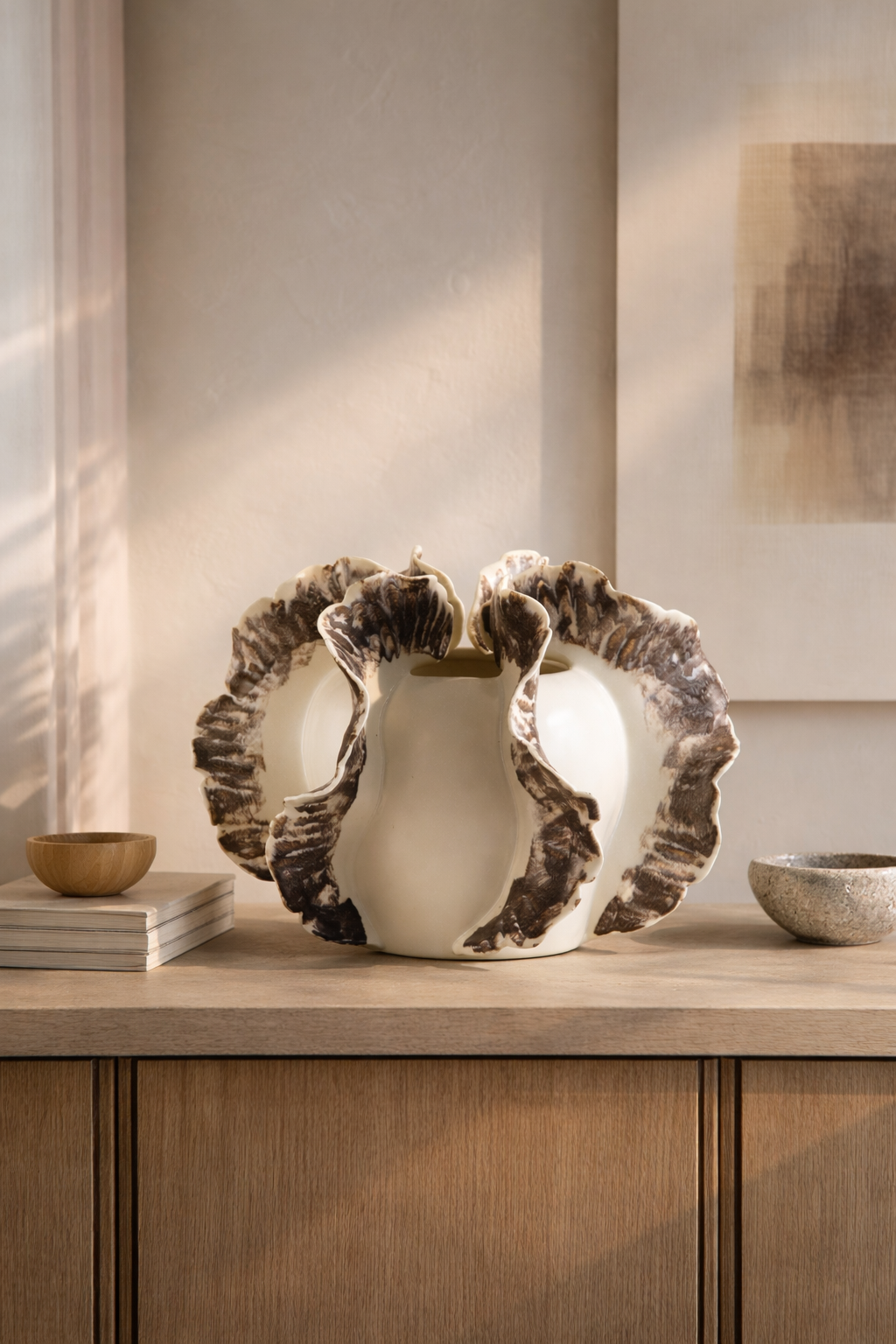 Decorative ceramic vase on a wooden surface with a neutral background