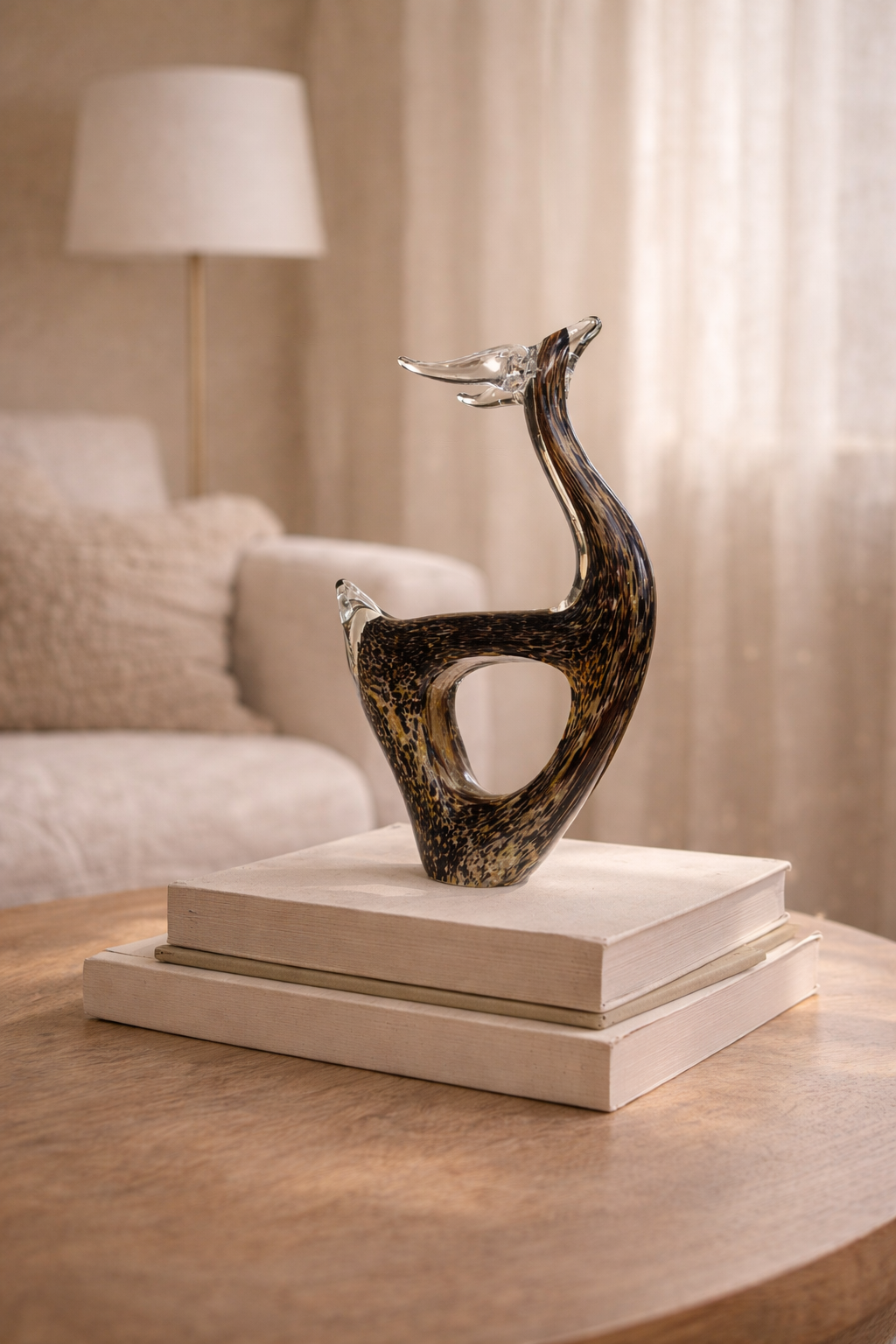 Decorative sculpture on a stack of books with a blurred background