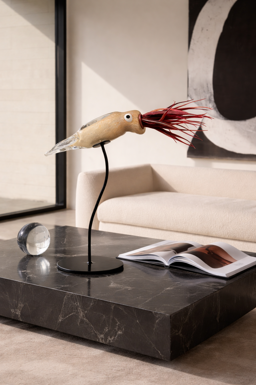 Decorative squid lamp on a marble coffee table with a modern interior setting.