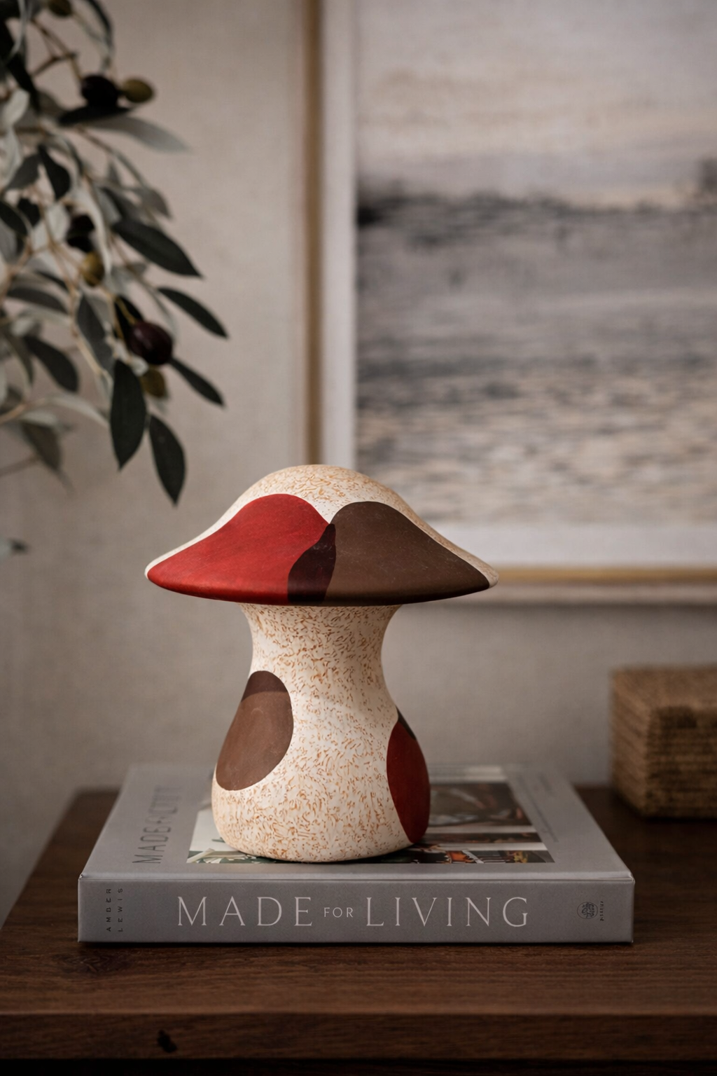 Mushroom-shaped decorative item on a book with a blurred background