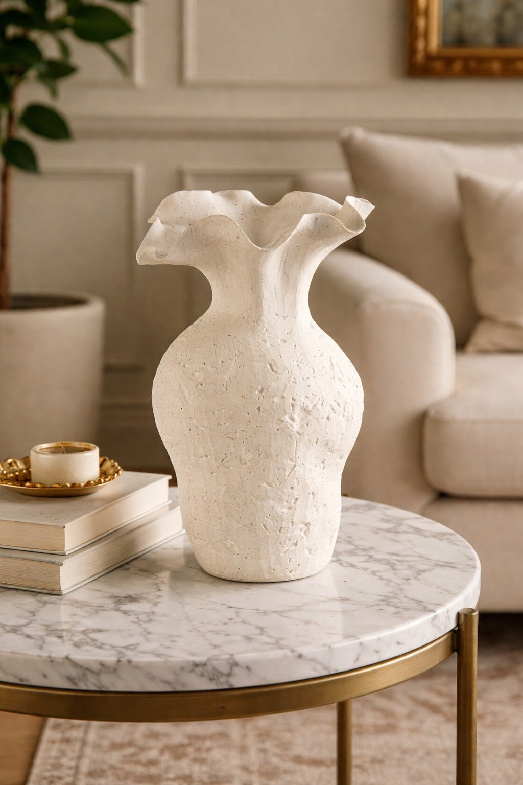 White textured vase on a marble table in a living room setting
